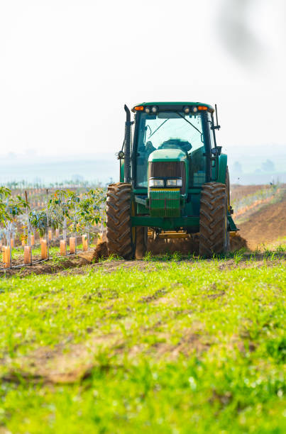 istock tractor cultivates agricultural land 1178783158