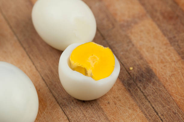 istock Egg on wooden board isolated on white background. 1178783222