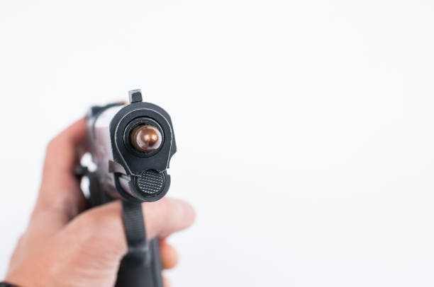 istock Gun and bullet isolated on white background. 1178783359