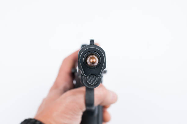 istock Gun and bullet isolated on white background. 1178783409