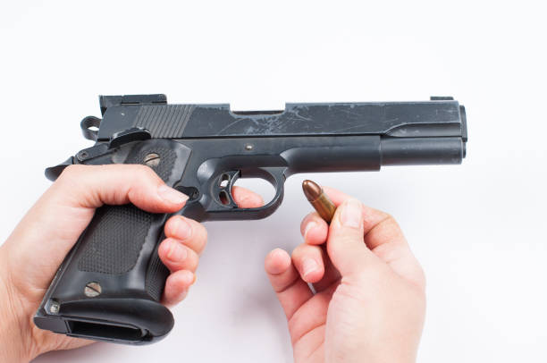 istock Gun and bullet isolated on white background. 1178783432