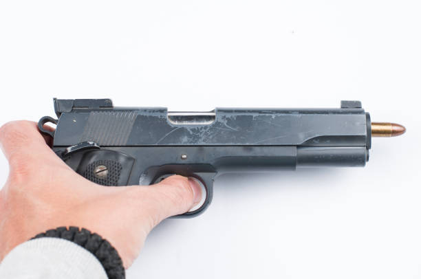 istock Gun and bullet isolated on white background. 1178783439