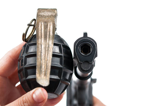 Gun and bomb isolated on white background.Copy space.