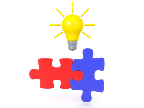 istock 3D Rendering of two matching puzzle pieces with bright lightbulb above 1178784887