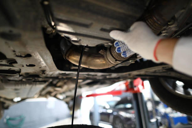 istock Black jet of used engine oil drains from the engine 1178786267