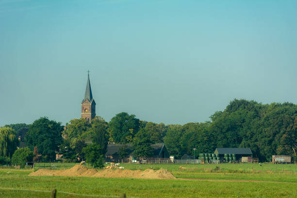 istock Church along dutch highway between trees and farm 1178787692