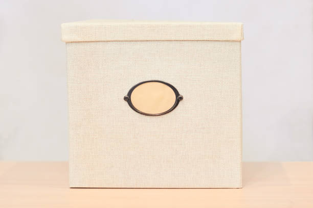 istock Storage box with label under the inscription, copy space. Braided box with a window for writing, close-up. Label for the inscription, close-up. 1178787938