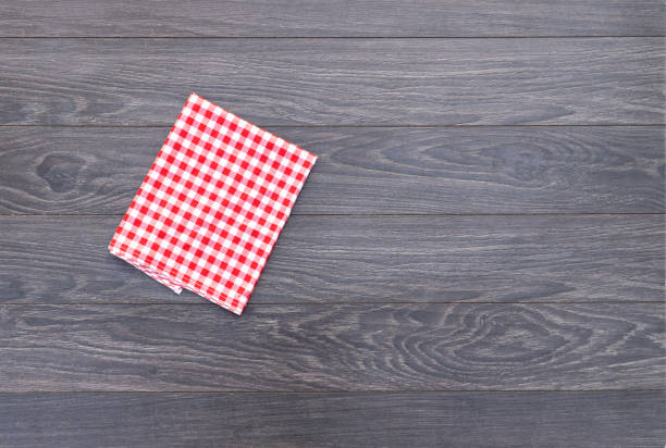 istock Kitchen plaid textile on old rustic wood. Food menu background Red checkered tablecloth 1178788335