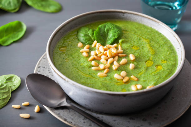 istock green creamy cauliflower spinach soup on gray background 1178788521