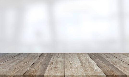 Hermosa mesa de madera vacía contra el desenfoque abstracto blanco interior fondo stock foto photo