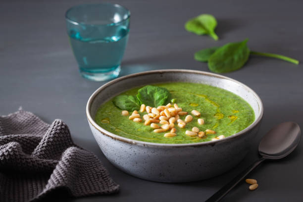 istock green creamy cauliflower spinach soup on gray background 1178789114