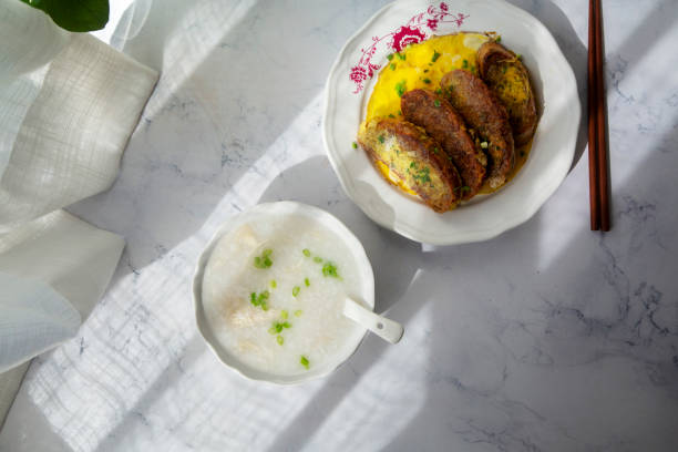 istock homemade healthy breakfast: chicken congee and egg fried bread slices 1178789367