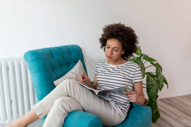 istock Woman reading a magazine 1178792356