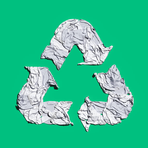 istock white recycling sign made from cloth on green background. Eco environment protection concept. 3d rendering. 1178792399