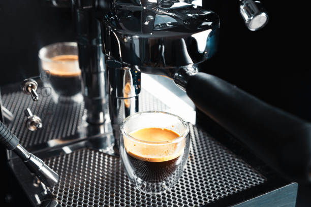 istock Metallic clean silver coffee machine in process of making fresh coffee. Preparing coffee at home. Home barista. 1178793419