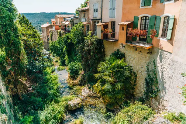 High angle view of stream flowing along town buildings in mountains, Gordes, Provence, France