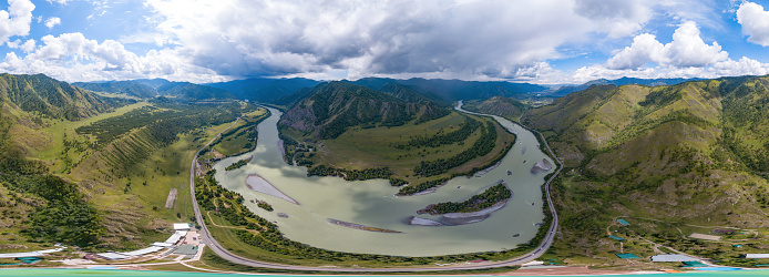 360 degree panoramic aerial view nature and picturesque landscapes near a mountain with a river and green trees on a summer day in cloudy weather and blue sky.