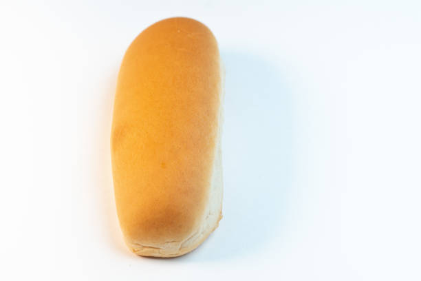 White bread on isolated background. Bun for hot-dog. Top view. Close-up. Space for text.