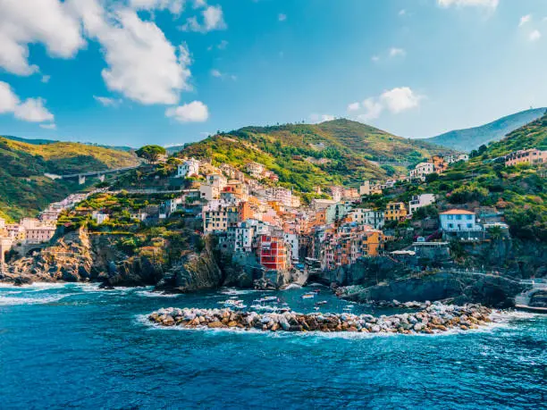 Aerial view of town in mountains towering over tranquil sea, Cinque Terre, Italy