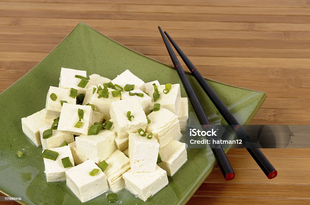 Tofu cubes with chopsticks  Backgrounds Stock Photo
