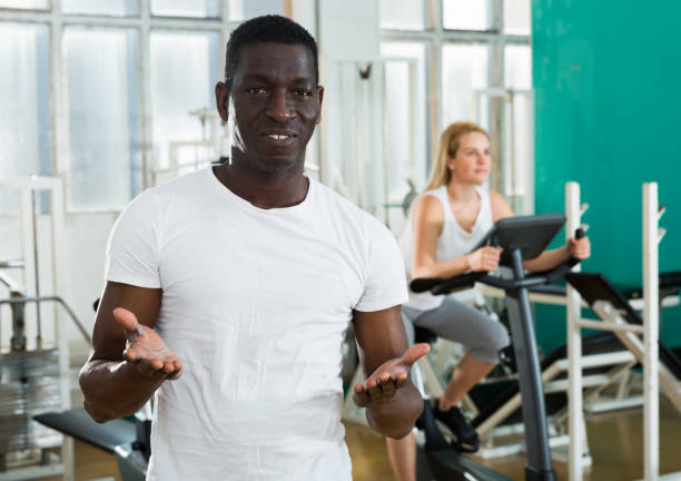 istock Friendly afro man welcoming to gym 1178806084