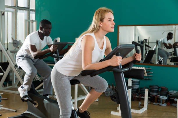 istock Couple training on stationary cycles 1178806187