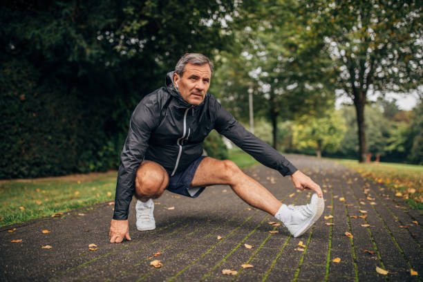 istock Man stretching after jogging in park 1178806442