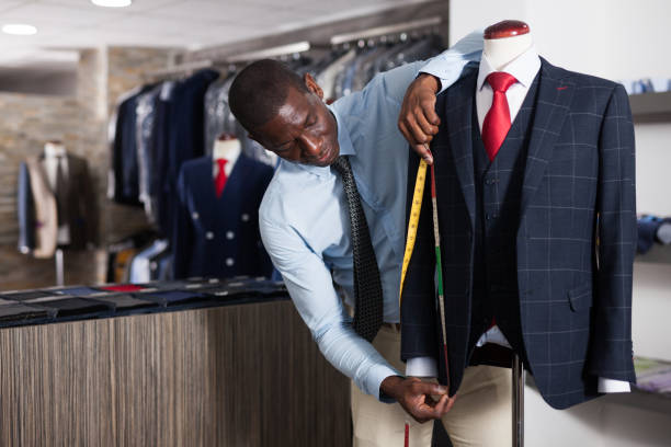 istock Tailor makes measurements of a business suit 1178807018