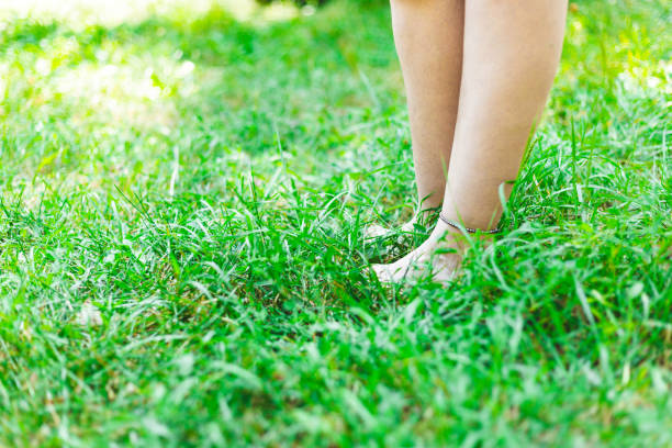 istock Barefoot young person in the grass 1178807062