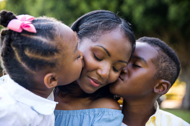 istock Kids kissing their mother 1178808409