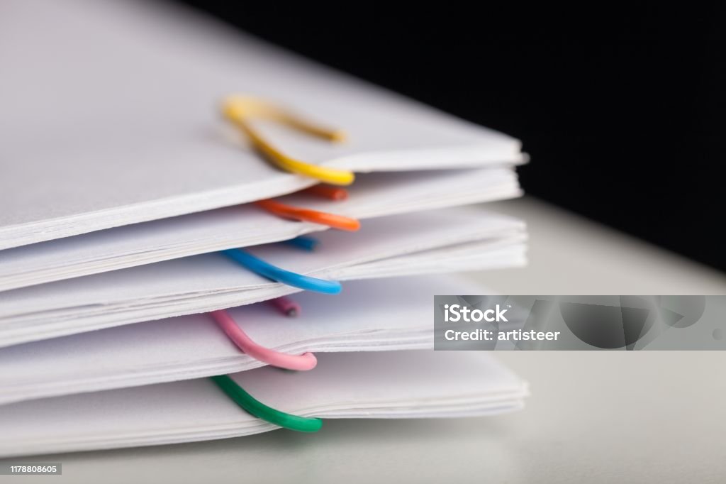 Paper. File folders with documents and bright paperclips Document Stock Photo