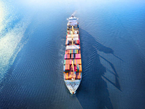 istock Large full loaded container ship sailing high seas. Aerial front view 1178810672