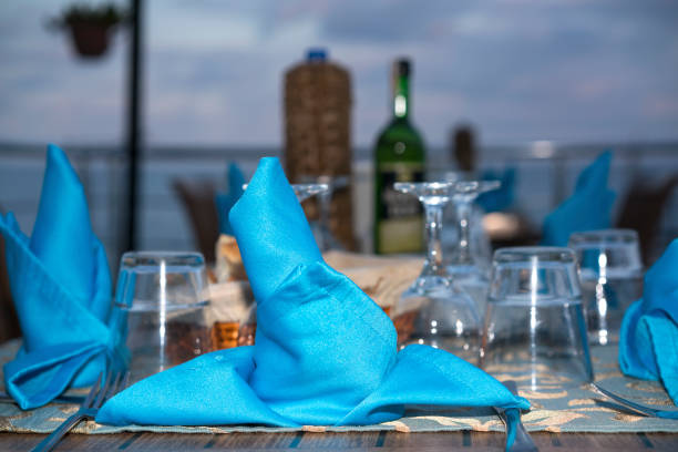 istock table at the beach with fish and wine 1178811775