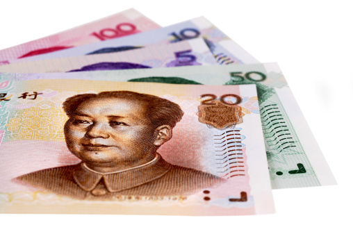 Chinese Yuan currency bills fully isolated against white.  Selective focus on the eyes.  Alternative file shown below: