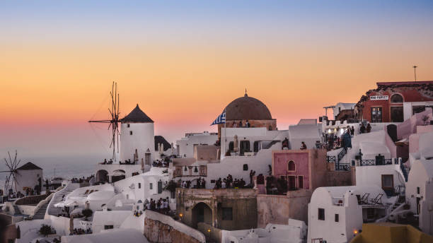 istock Typical greek windmill against summer sunset in Oia, Santorini - Greece 1178813883