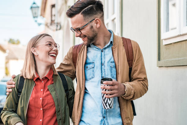 istock Young couple walking down the street 1178814358