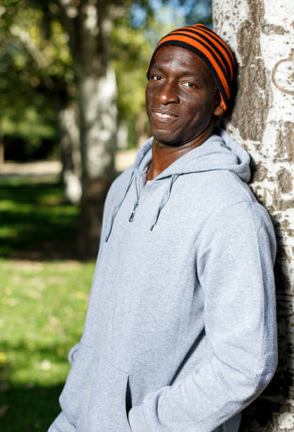 istock Athletic african  american male standing  near tree before training in park 1178815200