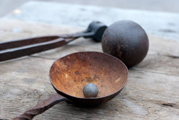 istock Old bullet and cannon ball 1178815801