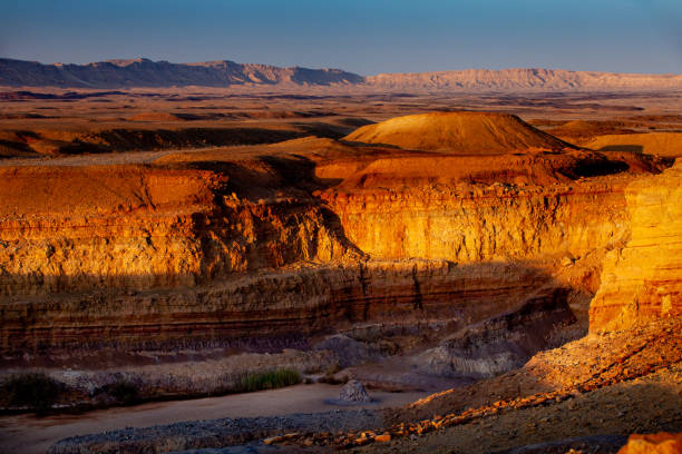 istock Sunset lights on hillside of ravine 1178816872