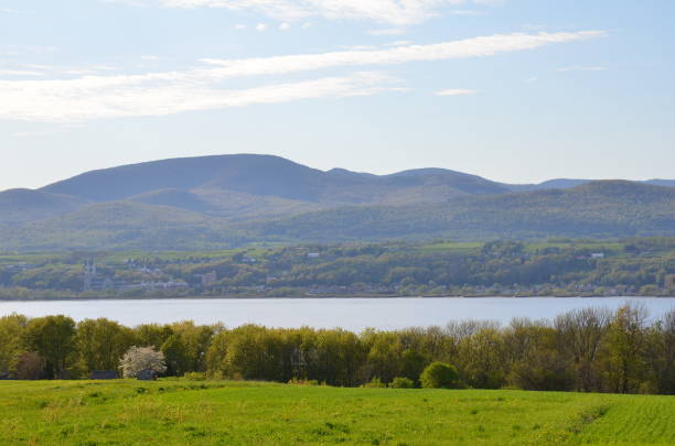 istock river and green grass and trees in Quebec, Canada 1178818457