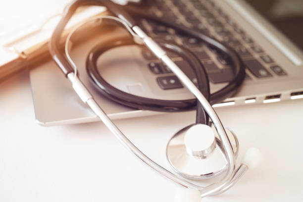 istock Stethoscope, prescription medical form lying on a table with pc computer. Medicine or pharmacy concept. Medical tools at doctor working table 1178819068