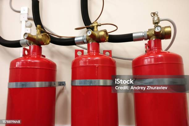 Automatic Gas Fire Extinguishing System Safety Of Premises From Conflagration Red Compressed Gas Cylinders To Prevent Fire Stock Photo - Download Image Now