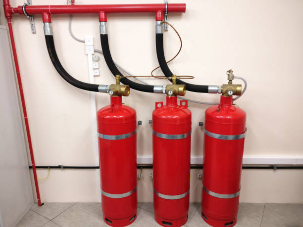 istock Automatic fire extinguishing system in the workplace. The security of your premises from conflagration. Red cylinders with compressed gas to prevent fire in the shop. 1178821585