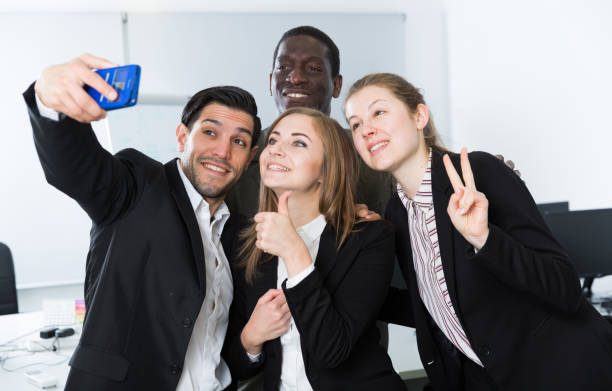 istock Cheerful business group taking selfie 1178821820
