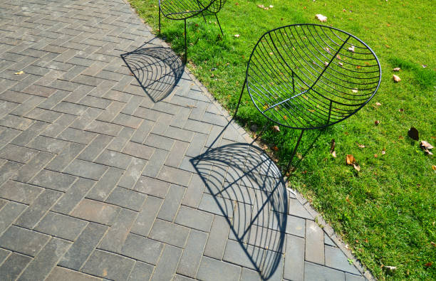 Beautiful modern wrought iron chairs in a city park