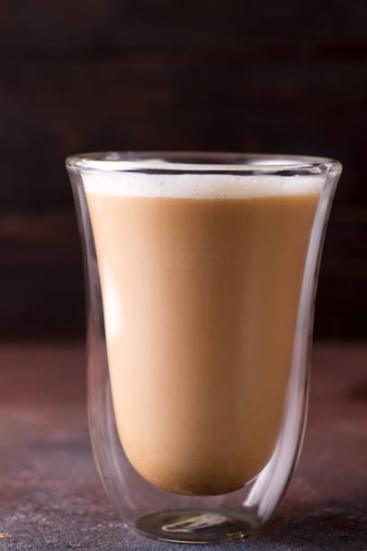 istock Glass cup of coffee latte on stone dark table 1178823936
