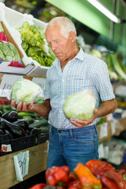 istock Man choosing vegetables in store 1178826088