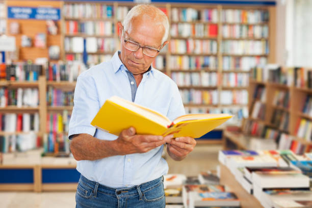 istock man reading new books 1178827050