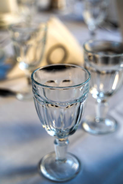 istock Transparent glass goblet table white napkin 1178827534