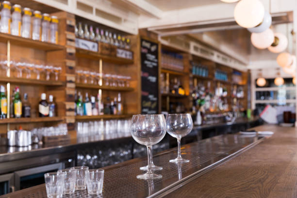 istock Empty wine glasses at bar counter 1178829911